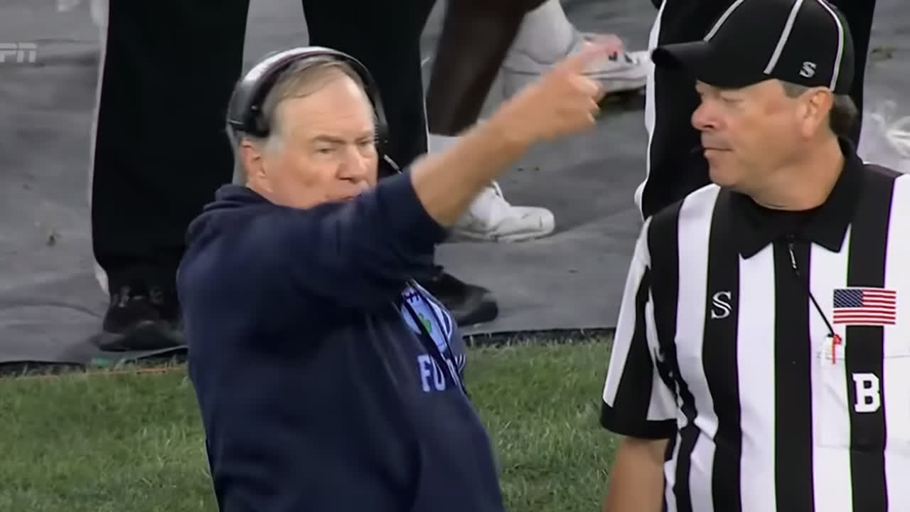 Bill Belichick working an official on the North Carolina sideline