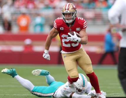 49ers running back Christian McCaffrey carries the ball against Miami